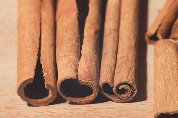 cinnamon sticks on wooden table