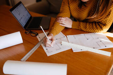 Freelance making sketch sitting at table