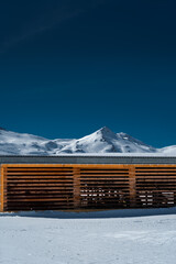 mountain hut in the snow, clear skies in Switzerland