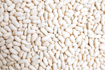Lots of white beans. Texture background. Top view