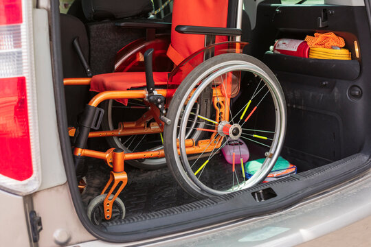 Wheelchair in open car trunk