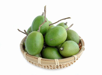 hog plums or Spondias mombin, Fresh ambarella, mombin hog plum fruit on bamboo colander on a white background.