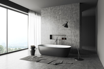 Grey bathroom interior with bathtub and panoramic window