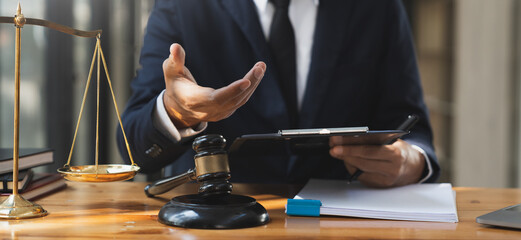 Law and justice concept Young lawyer or Asian legal advisor explaining contract rules to a consultant in a law firm.