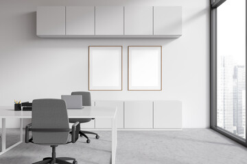 Naklejka na ściany i meble Light business interior with workplace and laptop, window. Mockup frames