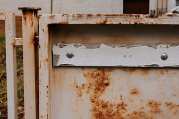 an old brown rusty mailbox