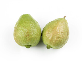 Fresh pink guava fruit, pieces and leaves isolated on white background.