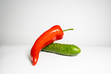 Fresh Cucumber and red pepper isolated on white background tasty and healthy food flat side view