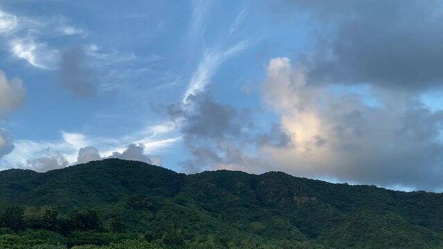 Moving clouds over the mountain during the sunset 