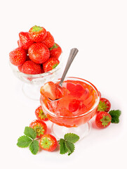Cream bowl, bowl with fresh strawberries and sweet strawberry jelly against white background
