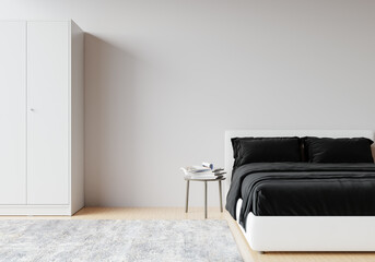 3d rendering A bedroom with a white bed, black bed linens placed on a wooden floor with a white blank wall gives a light and comfortable feeling.