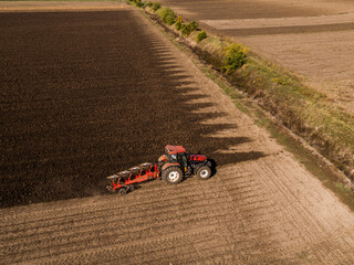 Scientific land preparation with tractor plowing and cultivating of stubble field