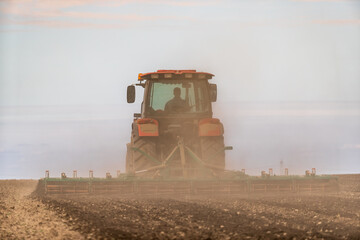 The promise of spring, tractor readying the fields for a new season of growth