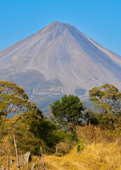 Fototapeta premium Road leading to the Colima volcano amidst a scenery