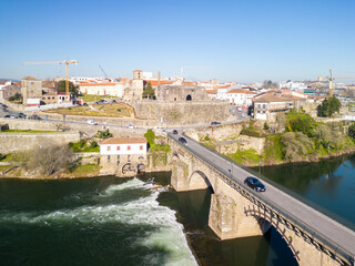 Aerial view of Barcelos city, district Braga, Portugal. Landscape on the river Cavado, Barcelos bridge, Paco dos Condes, water mill and church.