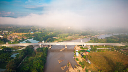 Aerial view of drone flying above Kok River, Chiang Rai Province, Thailand - 571174650