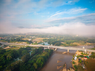 Aerial view of drone flying above Kok River, Chiang Rai Province, Thailand - 571174667