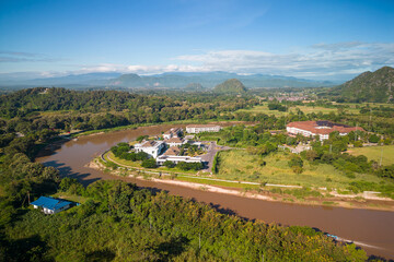 Aerial view of drone flying above Kok River, Chiang Rai Province, Thailand - 571174677