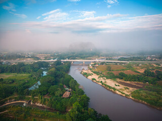 Aerial view of drone flying above Kok River, Chiang Rai Province, Thailand - 571174679