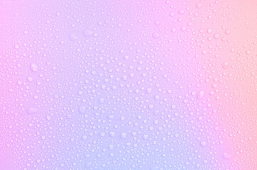 drops on a pastel multi-colored iridescent background
