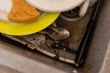 dirty dishes in the kitchen sink. A raid on plumbing