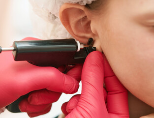 little girl during an ear piercing