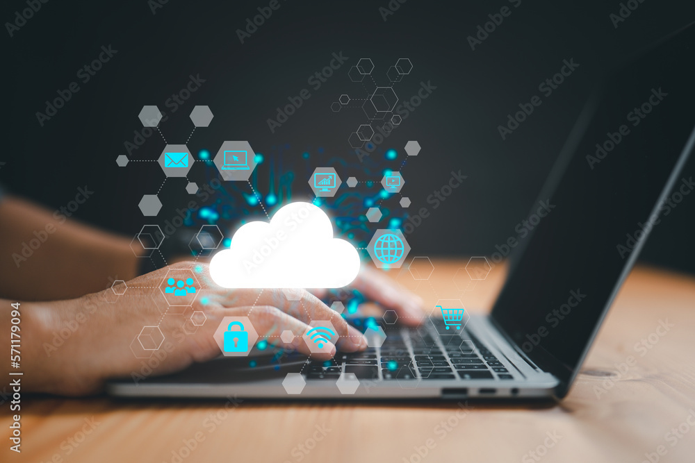Poster A businessman uses a laptop to access cloud computing, big data, the internet of things, business processes, and different storage systems..