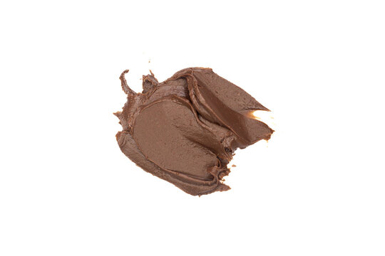 Melted chocolate cream spread isolated on a white background. Top view, flat lay.
