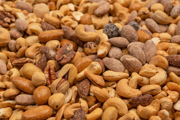 A group of almonds, pistachios, walnuts, macadamia, cashews.