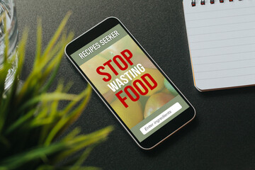Mobile phone with Stop Wasting Food message and recipes seeker app in the screen.