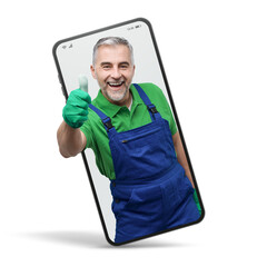 Happy professional gardener  in a smartphone videocall and smiling, online  service concept - obrazy, fototapety, plakaty