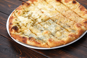 pizza on the wooden background