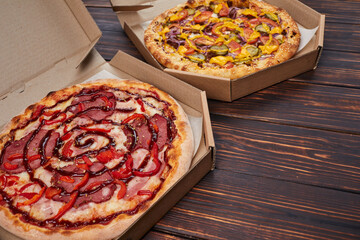 pizza  in the box on the wooden background