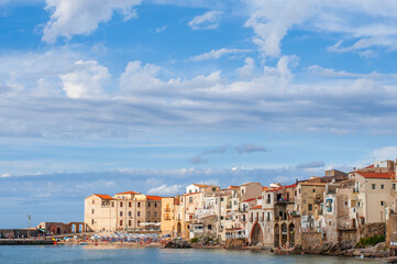 The fishing village of Cefalu in Sicily / The fishing village of Cefalu with its town beach on Sicily, Italy. - 571187261