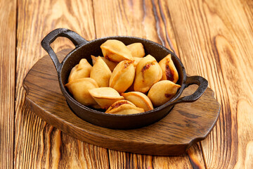 fried dumplings on the wooden background