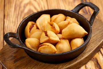 fried dumplings on the wooden background
