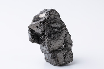 Obraz premium Natural black fossil coal on a white isolated background.
