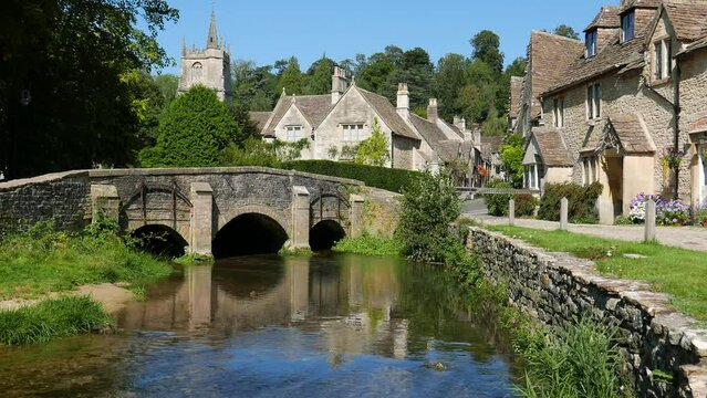 Castle Coombe in the Cotswolds, one of England's prettiest villages in Wiltshire .