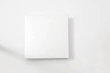 White textured box, gift mockup on white background.High resolution photo. Blank White Product Package Box Mock-up. Container, Packaging Template on white. Cardboard box.