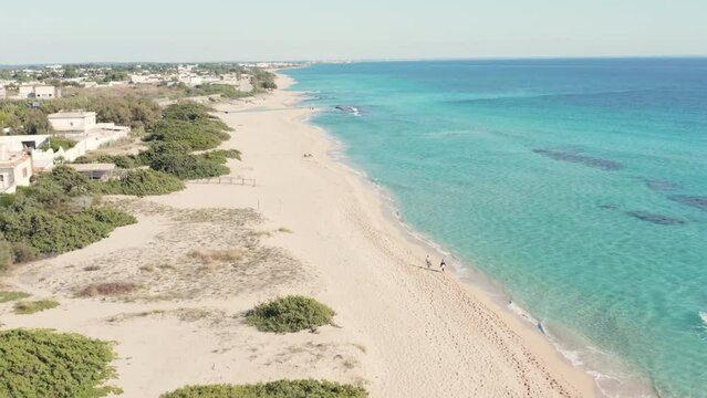 spiaggia di San Pietro in Bevagna, con le dune e il mare blu cristallino - Salento, Puglia, italy
