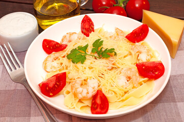 Pasta with shrimps, tomatoes and parmesan cheese
