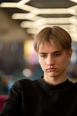 Fototapeta premium Portrait of Confident handsome teenager student. Vertical. Close-up.