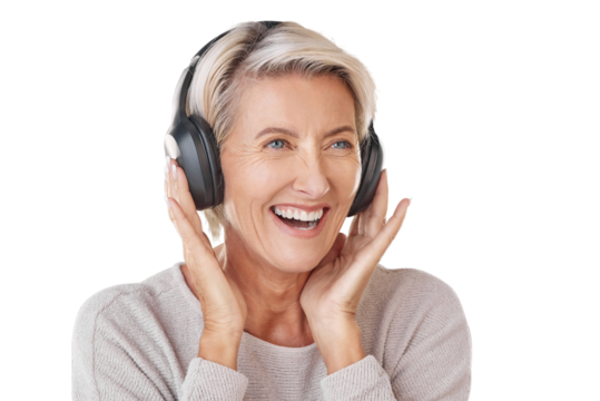 A happy mature woman wearing headphones to listen to music. Smiling caucasian senior with grey hair enjoying the loud music. Youthful and playful isolated on a png background.