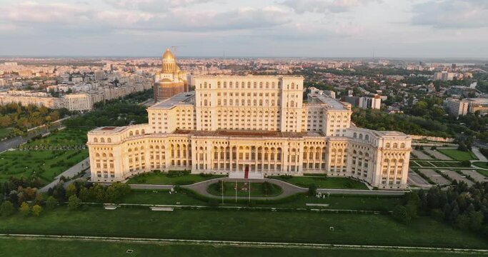 Palace of Parliament in Bucharest, Romania history Center aerial view at dawn in summer against blue sky
