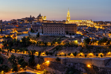 Naklejka premium View at sunset of the Primatial Cathedral of Saint Mary of Toledo otherwise known as Toledo Cathedral, is a Roman Catholic church in Toledo, Spain. Toledo was declared a World Heritage Site by UNESCO.