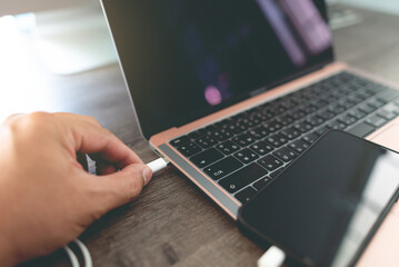 connect smartphone to the laptop with a USB cable.