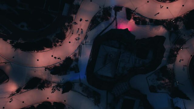 Aerial birds eye view of The Ribbon, an ice skating track snaking through the Maggie Daley Park downtown Chicago. 