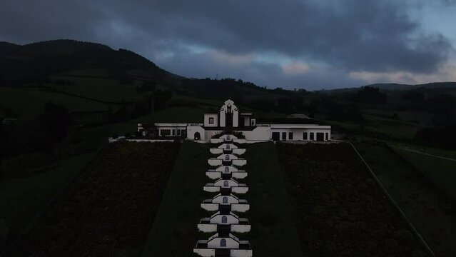 Aerial shot in the direction of the main door of the Chapel of Our Lady of Peace and during sunset. On the island of Sao Miguel, Azores.