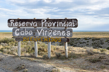 Wooden sign "Reserva Provincial Cabo Virgenes" at kilometer 0 of the famous Ruta40 in southern Argentina, Patagonia, South America