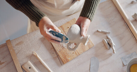 Pottery, art and senior asian woman mold clay in home studio or workshop. Potter, artist and...